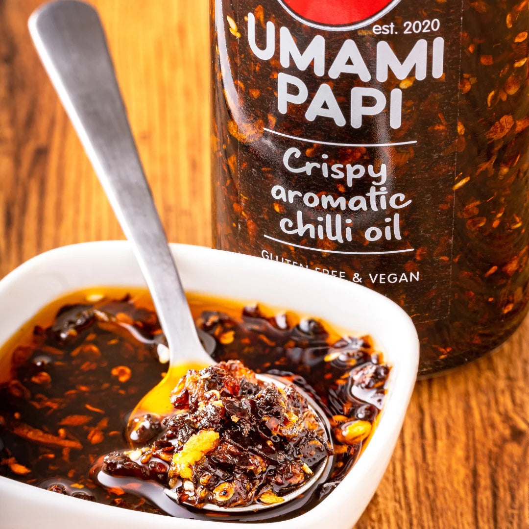 Picture of chilli oil in a bowl and jar of umamipapi crispy chilli oil